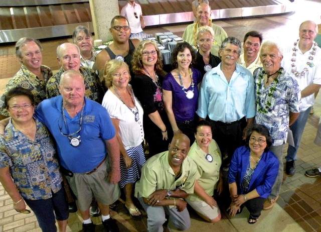 Members of the Rotary Club of Kapaa, the driving force behind the Kauai's water safety video, joined by Dr. Monty Downs (top right), president of the Kauai Lifeguard Association. 